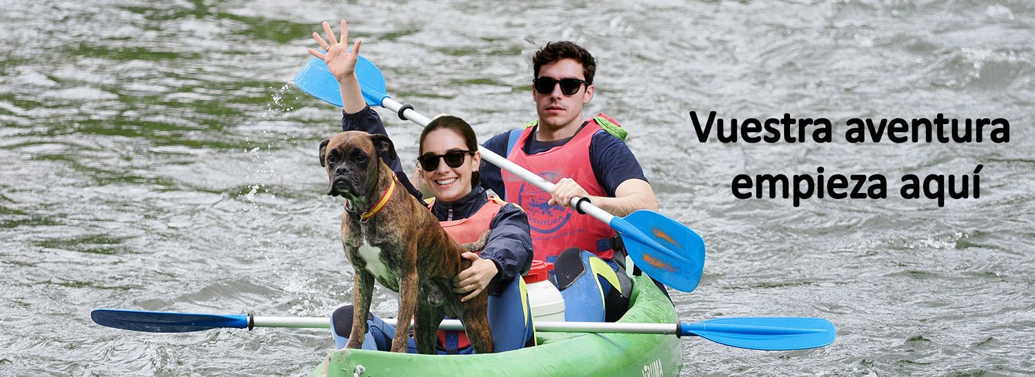 Pareja haciendo el descenso del Sella con su perro